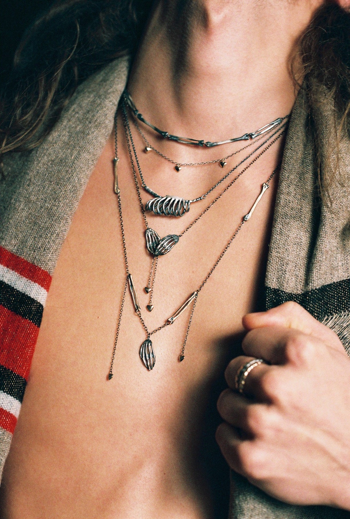 Milagros - necklace - silver hand with bronze bones and gold hearts